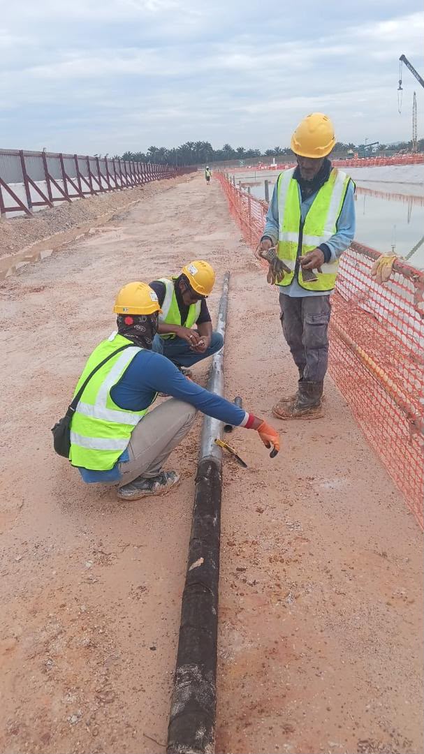 IT96 team laying network cable on site