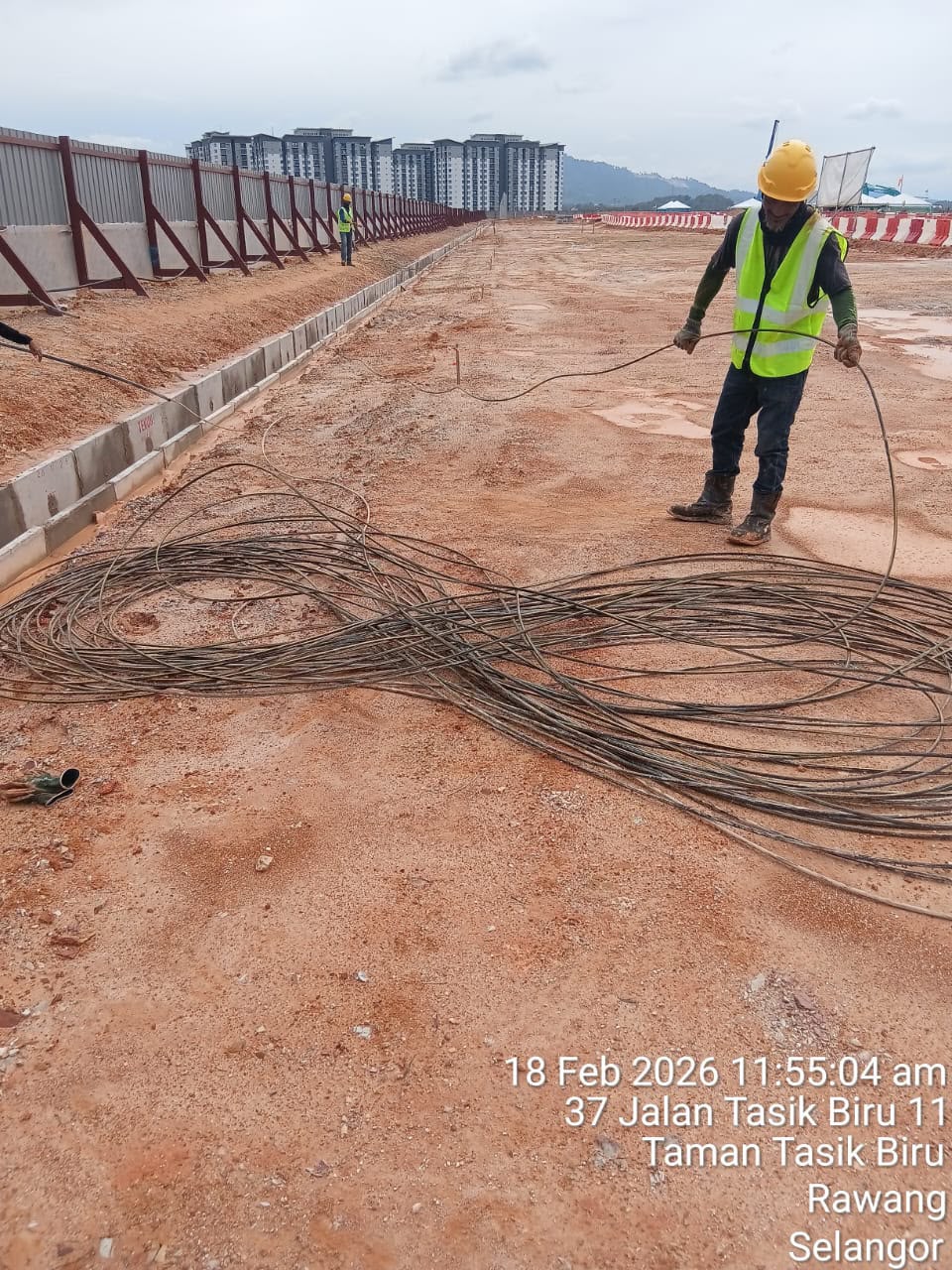 IT96 technician on a ladder running cable